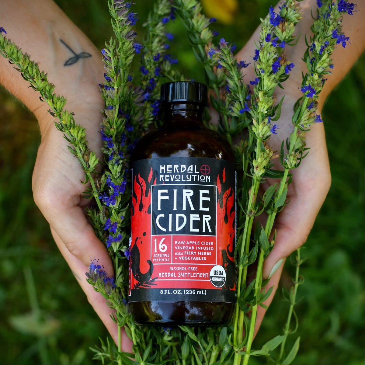 Herbal Revolution Fire Cider bottle with salad dressing and roasting ideas.