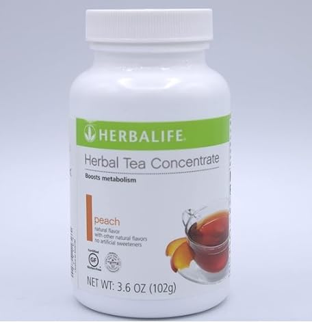 Herbalife Peach Tea Concentrate bottle pouring for quick peach tea