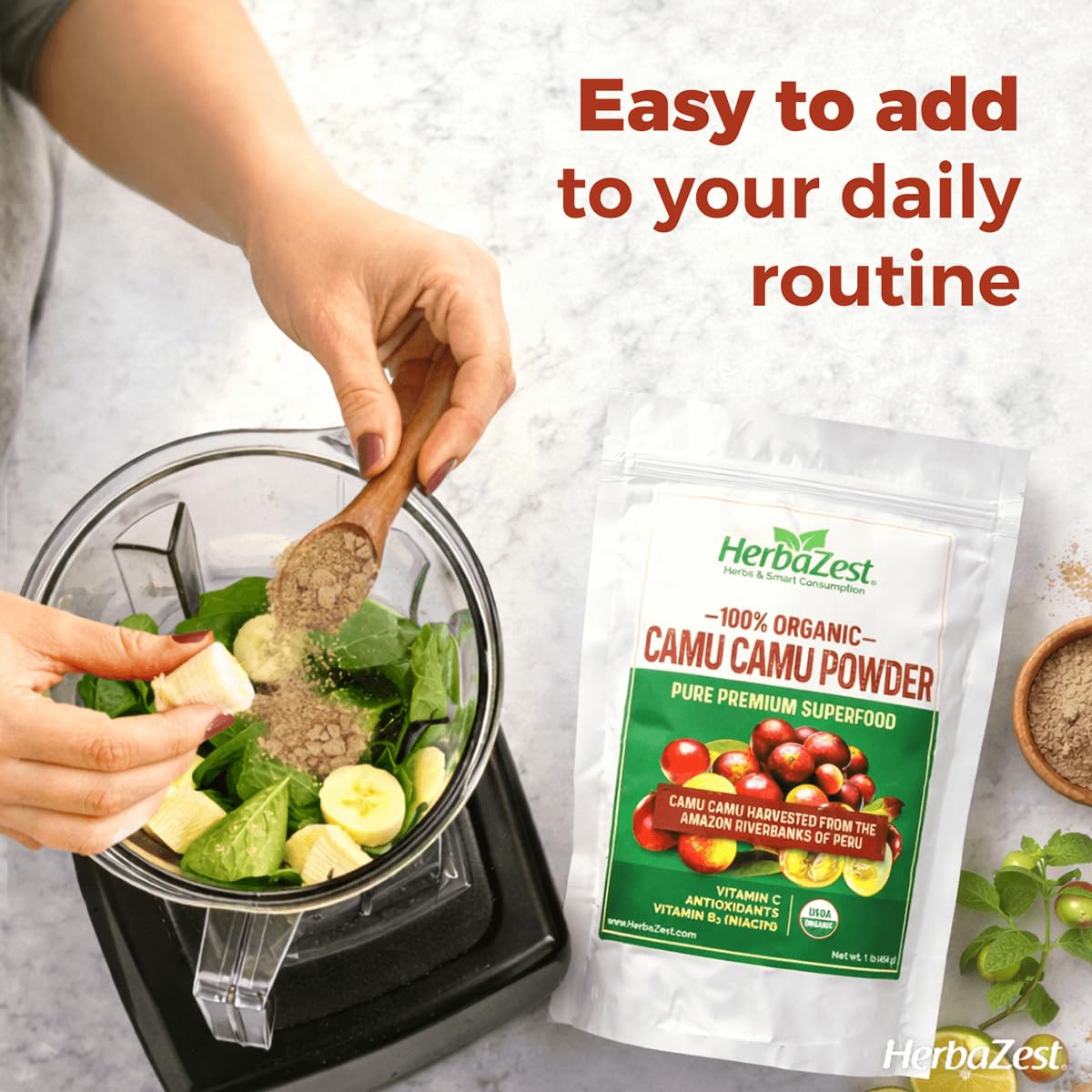 HerbaZest Camu Camu powder scoop in use with vibrant tart color.