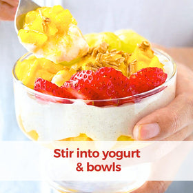 HerbaZest Camu Camu powder atop yogurt bowl adds bright flavor.