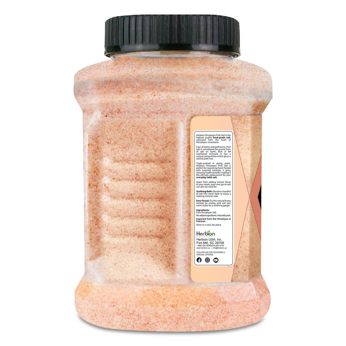Close-up of pink salt crystals in the jar highlighting mineral-rich texture.