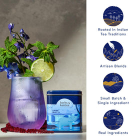 Herbs & Kettles Lavish Blue Tea hot or iced serving in a clear glass.