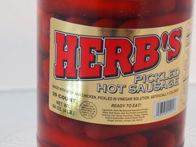 Herbs Red Hot Pickled Sausage close-up highlighting spicy bite