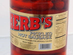 Herbs Red Hot Pickled Sausage plated for serving at a gathering