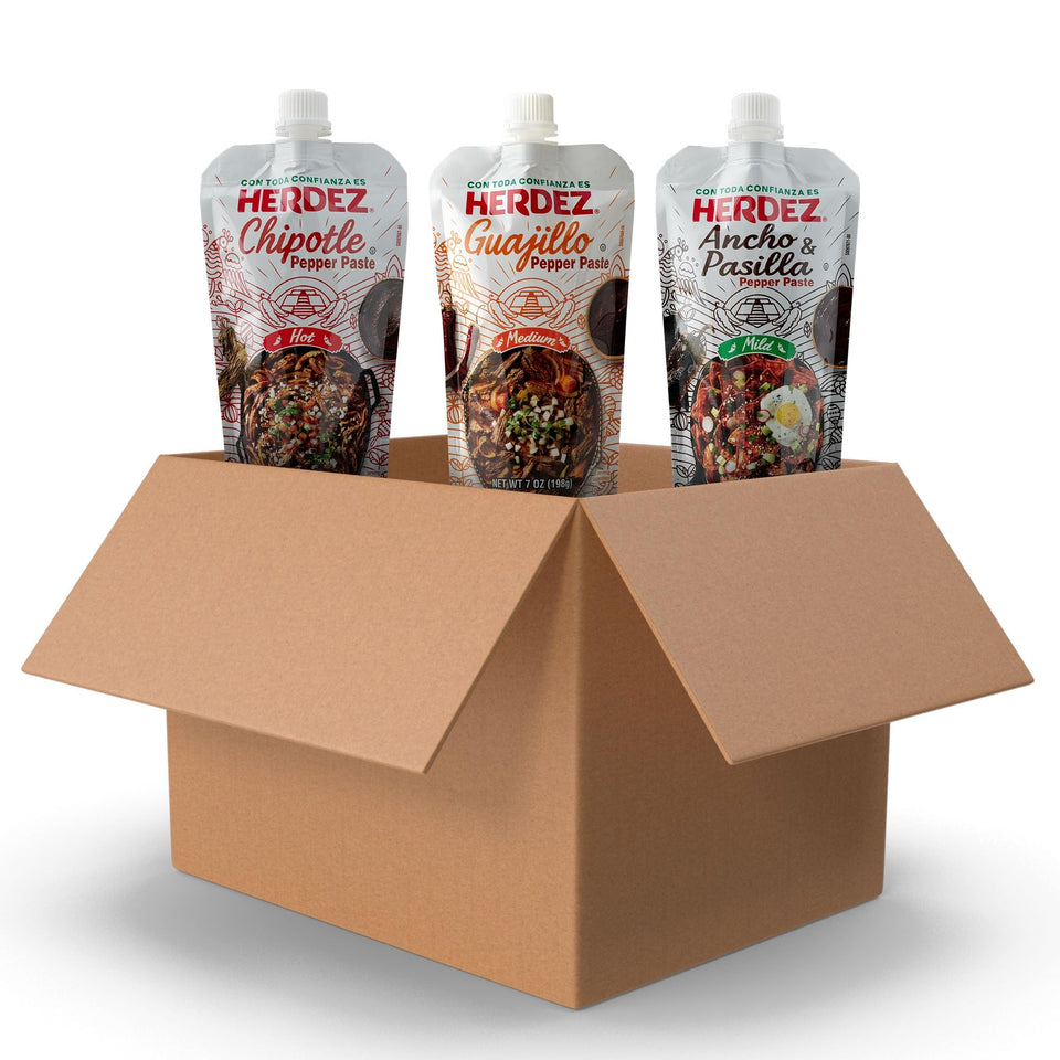Herdez Chipotle Pepper Paste squeeze bottle showing smoky heat for tacos and sauces.