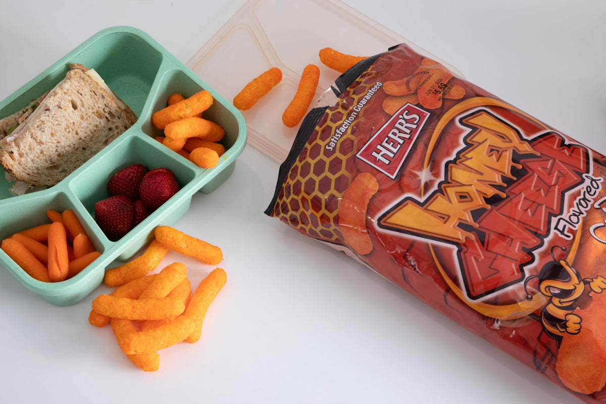 Herr’s Honey Cheese Curls at a party setup for easy snacking
