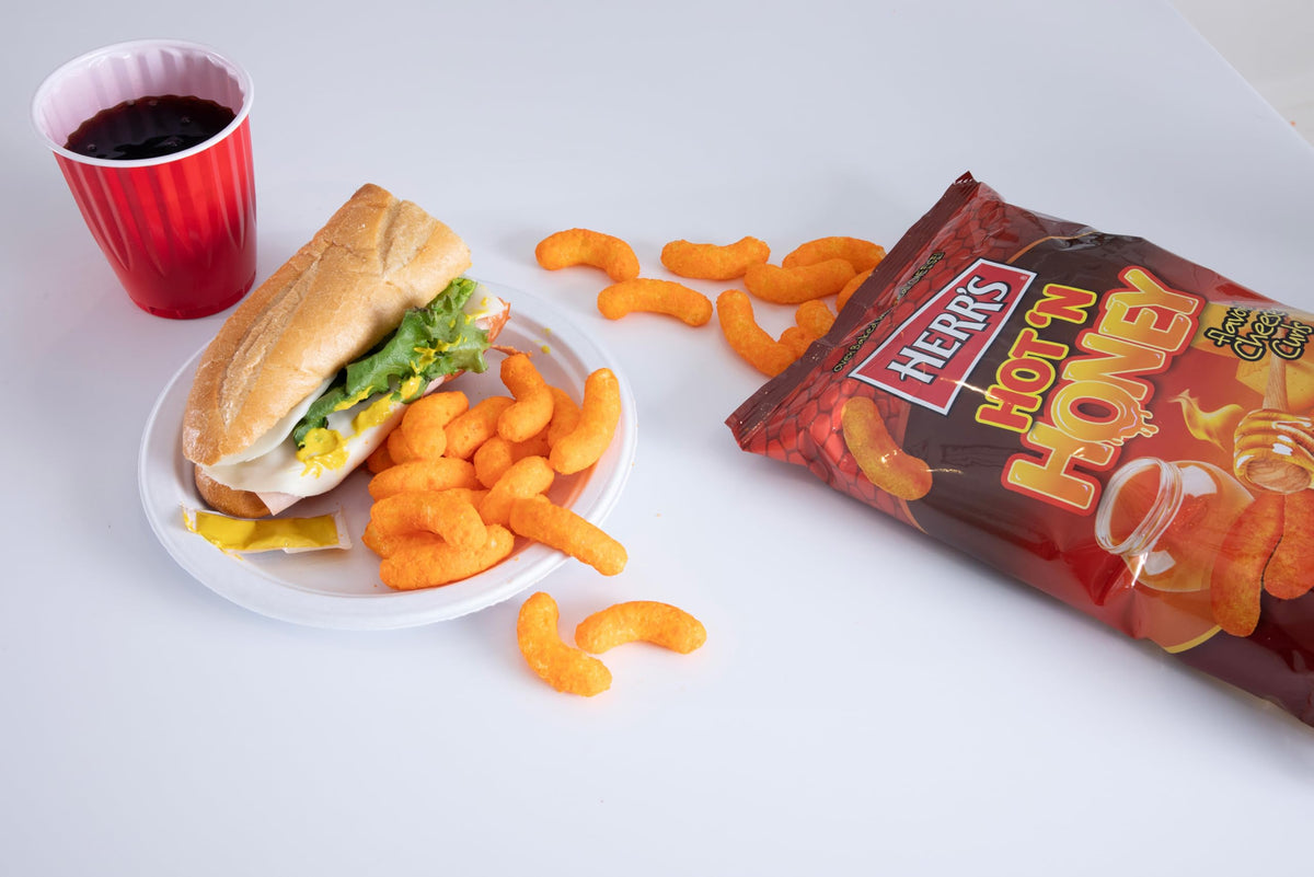 Herr's Hot & Honey Cheese Curls snack pack for convenient lunches