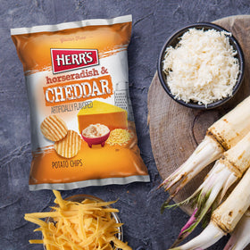 Herr's horseradish cheddar chips serving suggestion image evokes quick meals or lunchbox treats.
