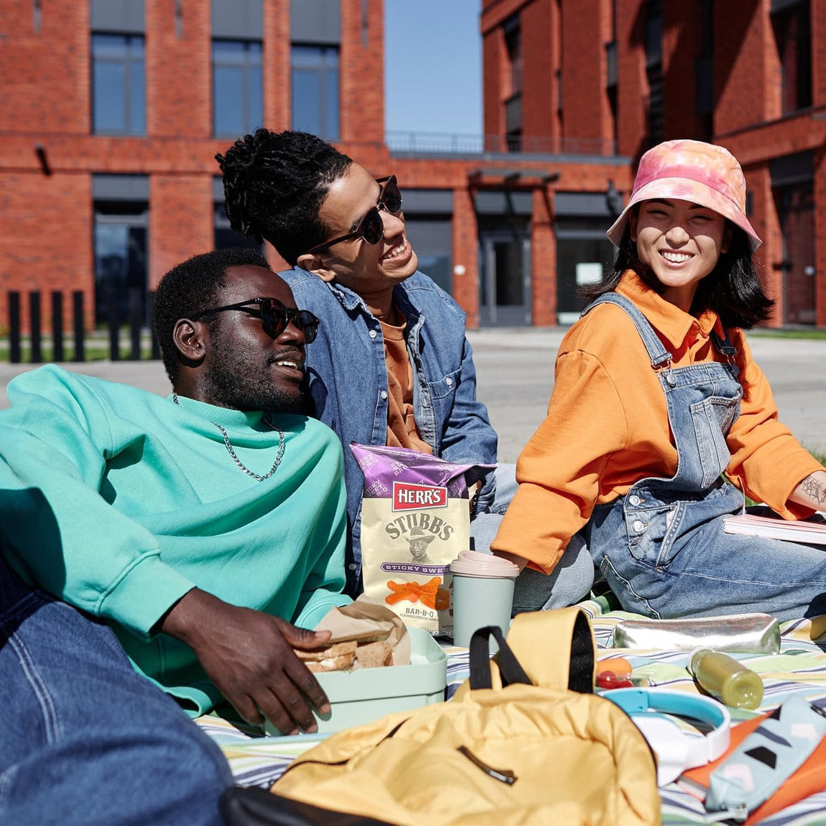Grill-out setting with Herr's Stubb's Bar-B-Q Cheese Curls for summer events