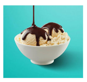 Pouring Hershey Simply 5 over ice cream for a glossy, rich chocolate topping