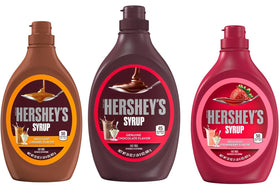 Hershey's Chocolate Syrup bottle pouring on ice cream for rich chocolate flavor