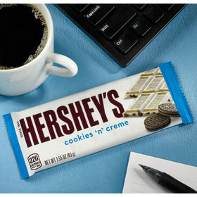 Hero party snack display featuring HERSHEY'S Cookies 'n' Creme bars for mingling.