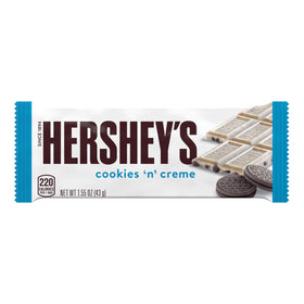 Close-up of creamy white creme with cookie pieces in HERSHEY'S Cookies 'n' Creme bar.