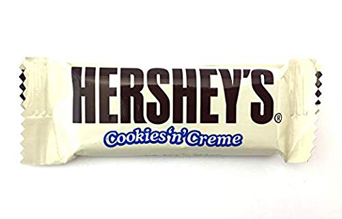 Cross-section of Hershey's Cookies 'n' Creme showing cream and cookie bits.