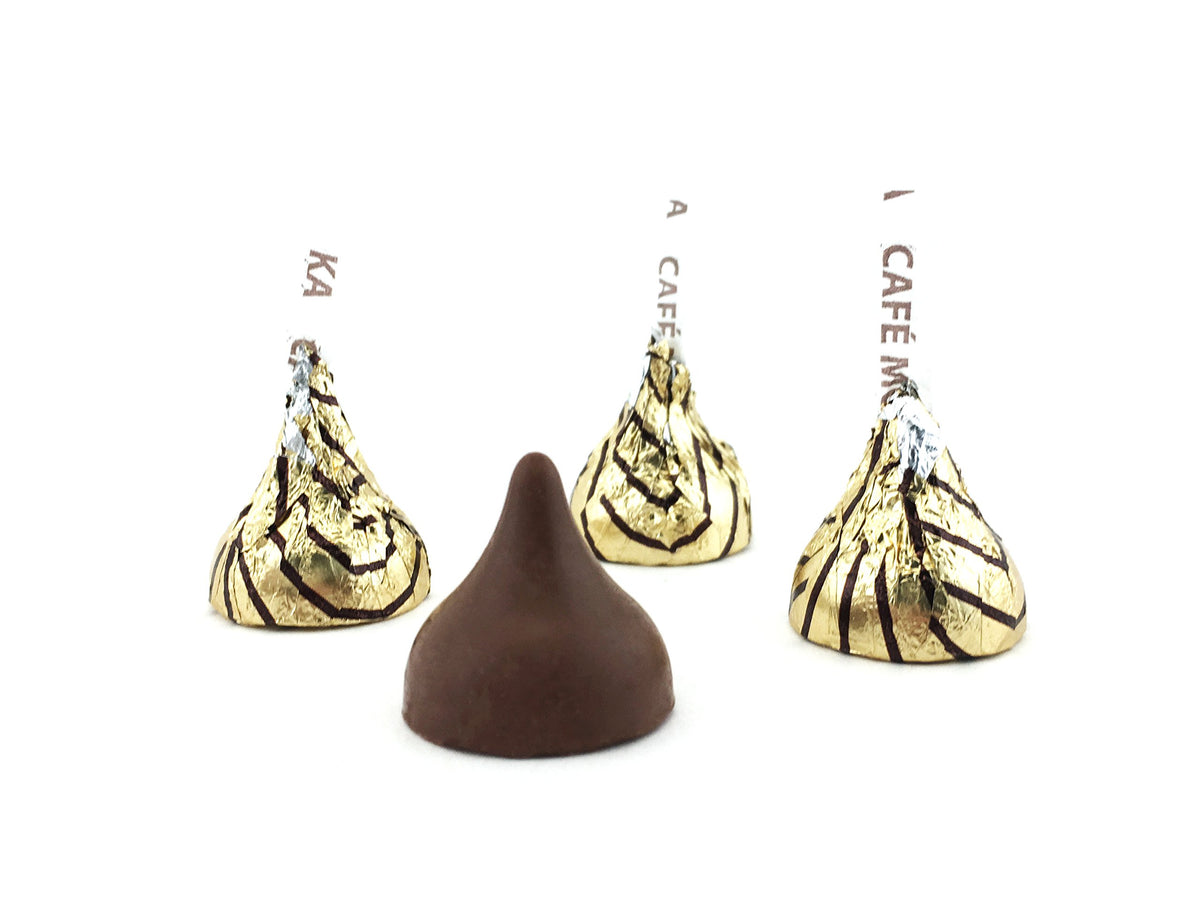 Hershey's Kisses Espresso close-up on gold foil, inviting cafe mocha aroma