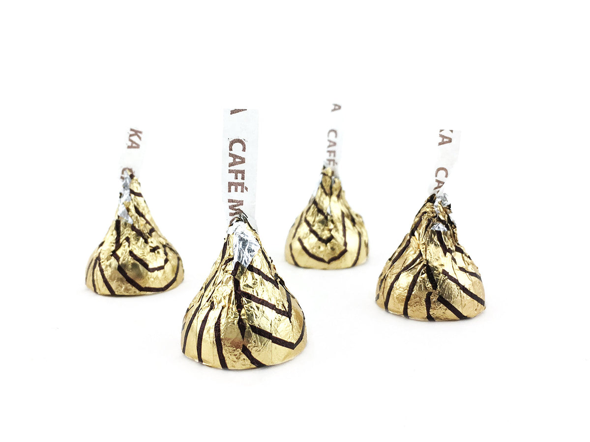 Hershey's Kisses Espresso unwrapped close-up, glossy milk chocolate with cafe mocha hints