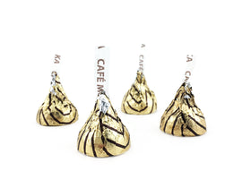 Hershey's Kisses Espresso unwrapped close-up, glossy milk chocolate with cafe mocha hints