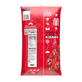HERSHEY'S KISSES red foil wrappers closeup, showcasing creamy milk chocolate morsels for holiday treats.