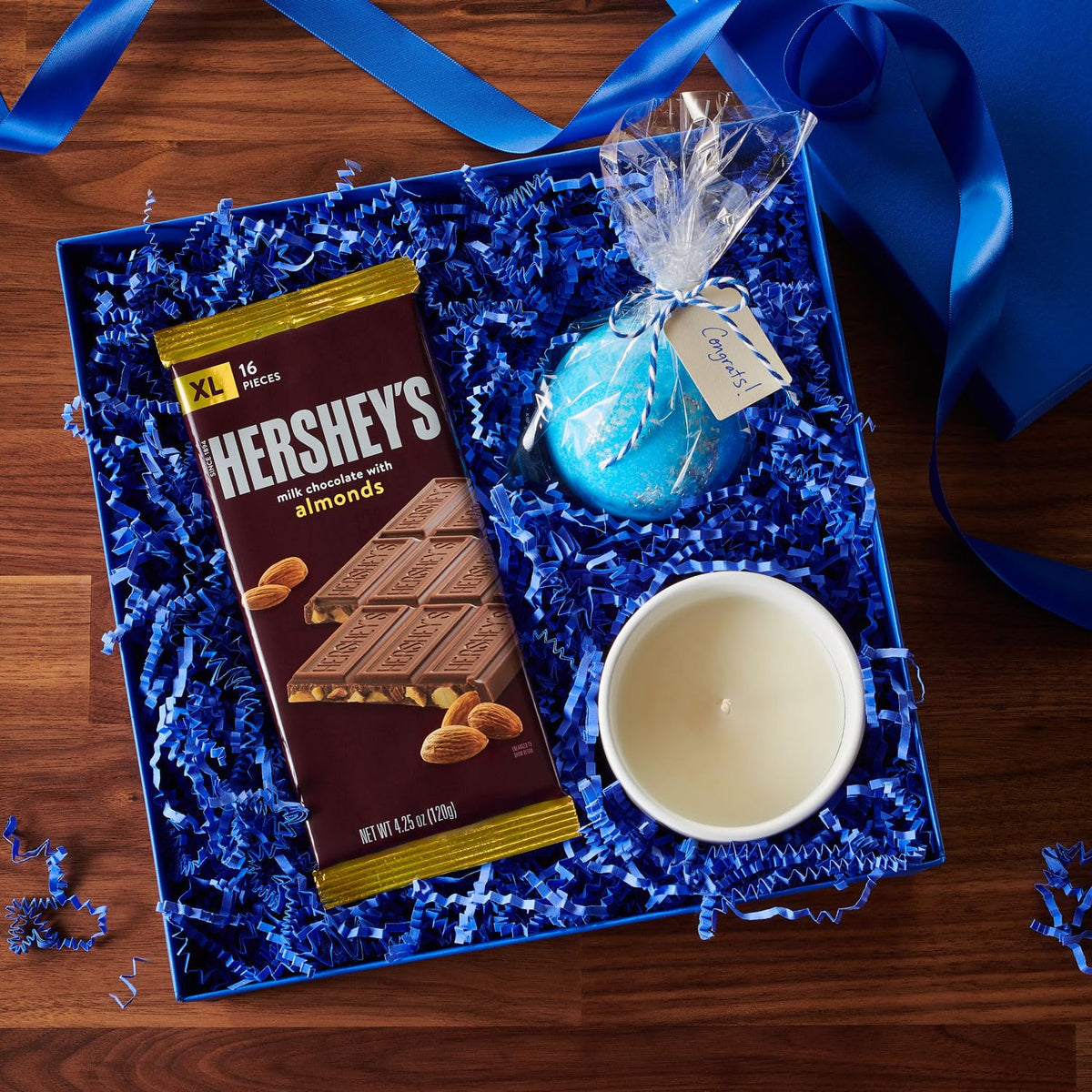 Movie night scene with HERSHEY'S XL bars; effortless sharing among friends.