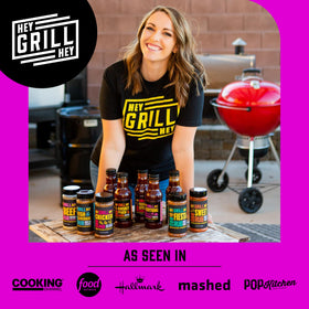 Hey Grill Hey Beef Rub bottle on an outdoor table ready to grill