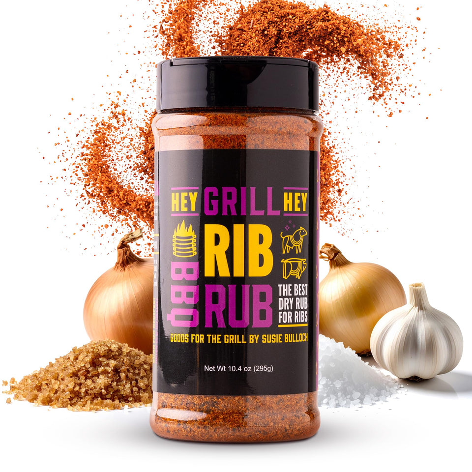 Hey Grill Hey Rib Rub bottle on pork ribs, flavor boost ready to grill