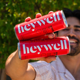 Heywell Sparkling bottle held in hand, ideal for focused afternoons.