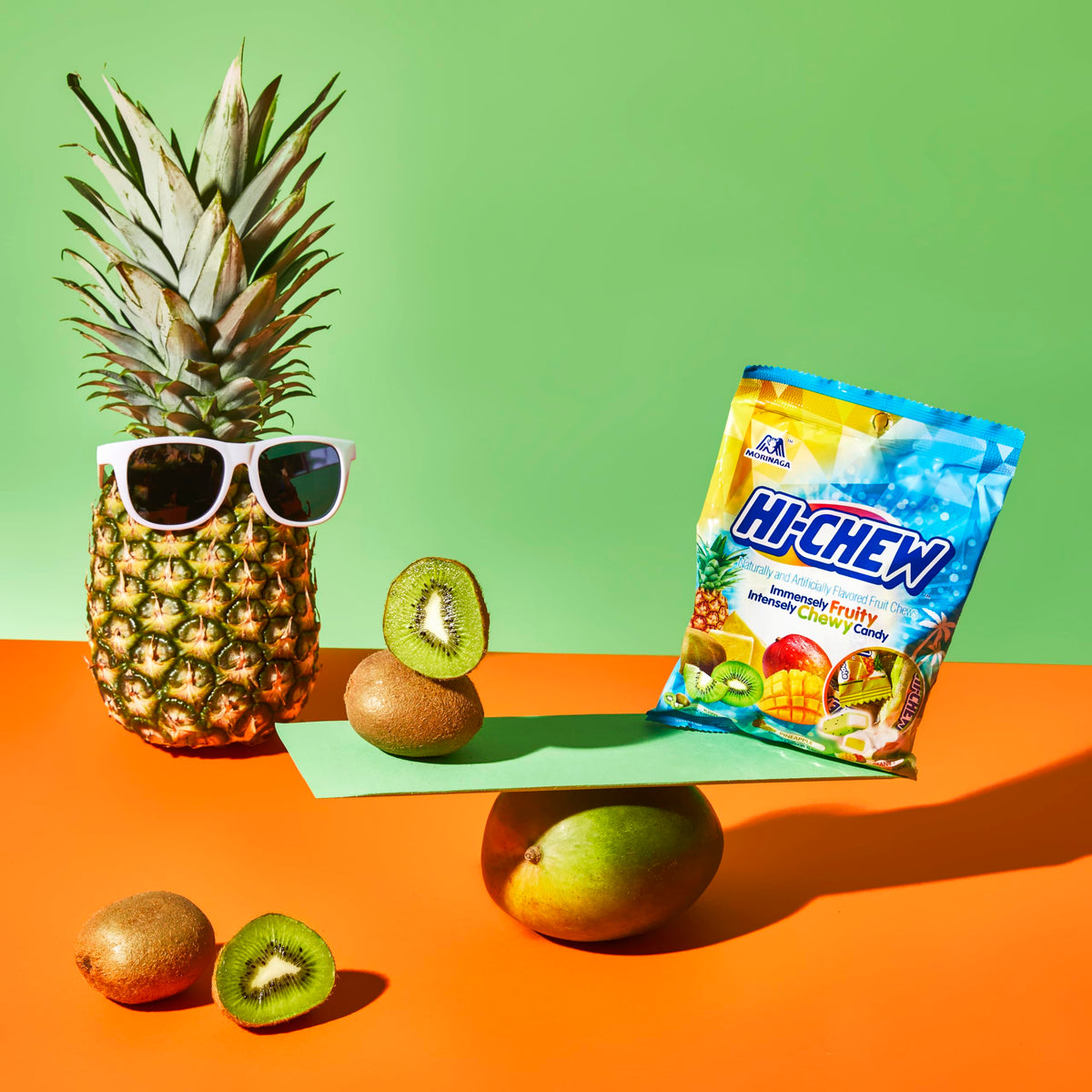 HI-CHEW Tropical Mix Mango Dragon Fruit flavor display, vibrant and juicy.