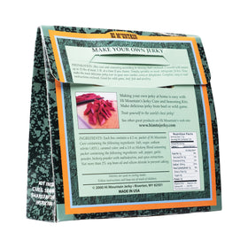 Seasoning dusting on meat with Hi Mountain kit