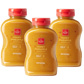 Hickory Farms Honey Pineapple Mustard jar on a tasting board, ideal with cheese.