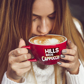 Hills Bros cafe-at-home experience with frothy, indulgent foam.