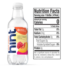 Pouring Hint water into a glass to savor crisp fruit flavor.