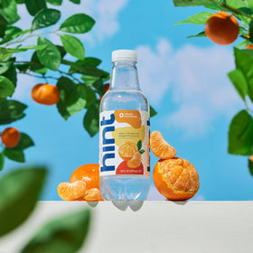 Hint glass with Tangerine-infused water presents a refreshing, calorie-free sip.