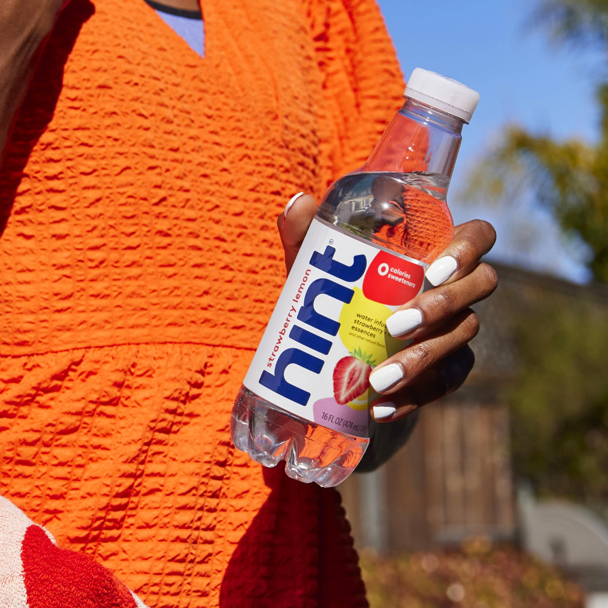 Hint Strawberry Lemon bottle on fridge-ready display signals on-the-go hydration appeal.