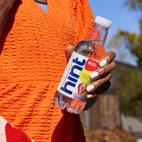 Hint Strawberry Lemon bottle on fridge-ready display signals on-the-go hydration appeal.