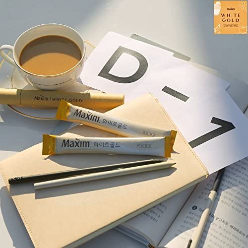 Hot steam rises from a Maxim White Gold cup for a comforting moment.