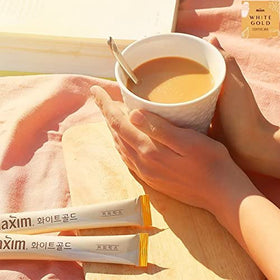 Close-up of Maxim White Gold sticks highlighting smooth texture and aroma.