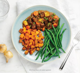 HMR Beef Stew microwave-ready plate demonstrating quick 1-minute heating for busy evenings.