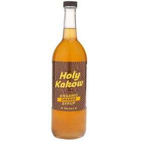 Holy Kakow orange syrup bottle pour enhances coffee flavor with authentic citrus notes