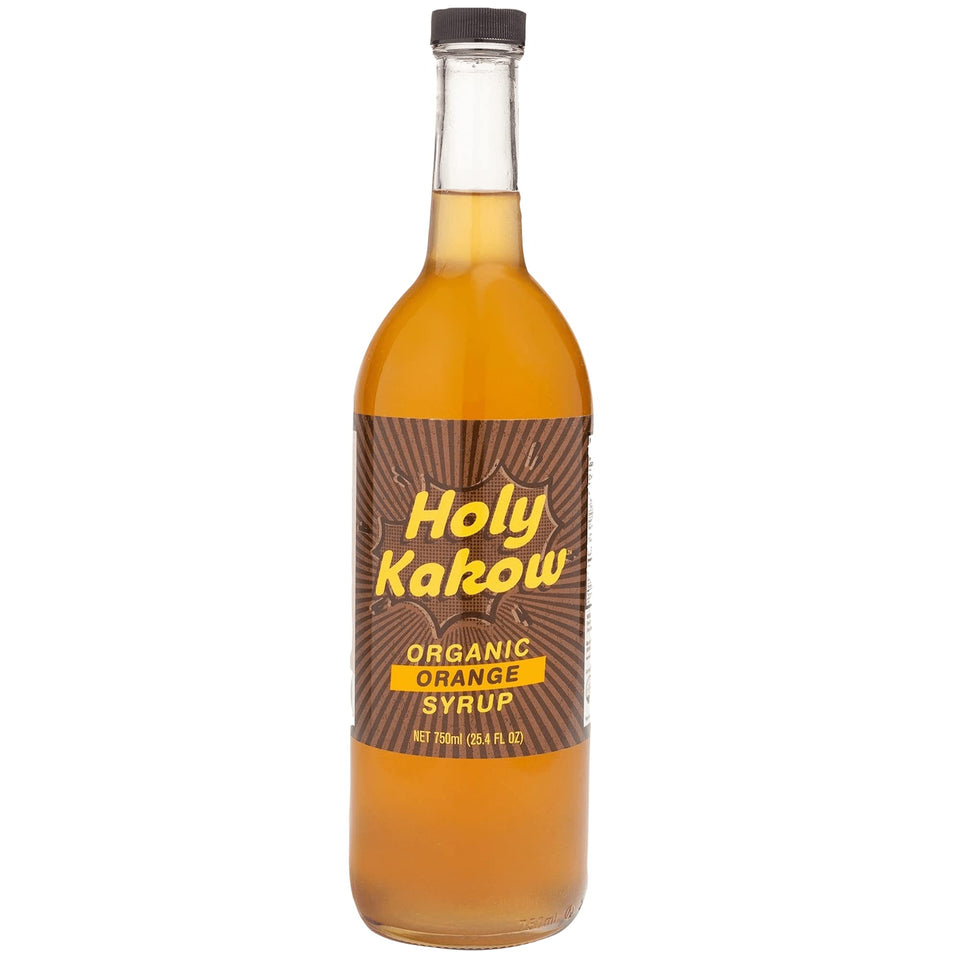 Holy Kakow orange syrup bottle pour enhances coffee flavor with authentic citrus notes
