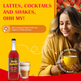 Glass of lemonade with Holy Kakow Strawberry Syrup for a fruity twist.