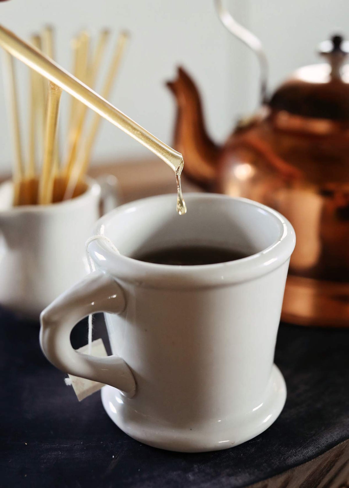 Close-up of a Honey Acres Clover honey straw showing rich amber honey ready to enjoy.