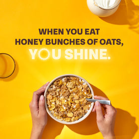 Honey Bunches of Oats honey roasted cereal cup close-up emphasizes crispy granola clusters for texture.