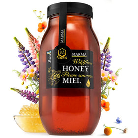 HONIGMA Marma Wildflower Honey bottle pouring for tea and toast.