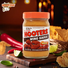 THE ORIGINAL HOOTERS Hooters Original Medium Wing Sauce bottle close-up shows rich texture for dipping.