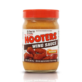 THE ORIGINAL HOOTERS Hooters Original Medium Wing Sauce bottle pour highlights bold flavor for wings.