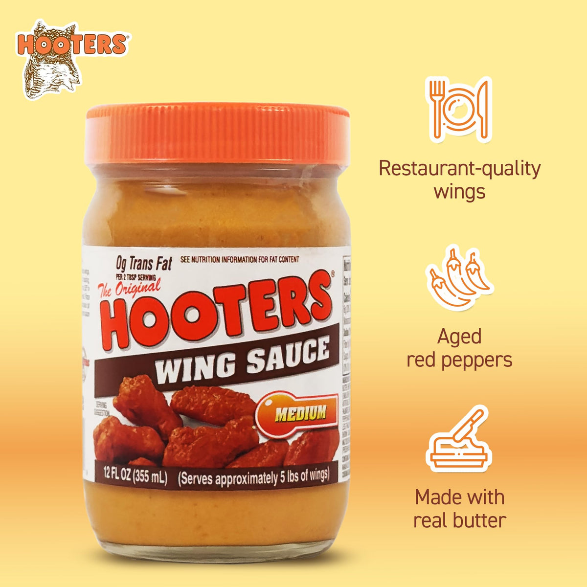 THE ORIGINAL HOOTERS Hooters Original Medium Wing Sauce on a dipping plate for tastier snacking.