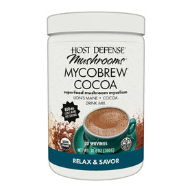 Host Defense MycoBrew Cocoa packet pouring into a cup for a chocolatey Lion's Mane blend.