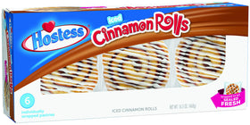 Hostess Danish Snack Cakes iced roll unwrapped, ready for a quick treat.