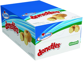 Hostess Donettes glazed mini donuts on pack front, ideal morning snack.