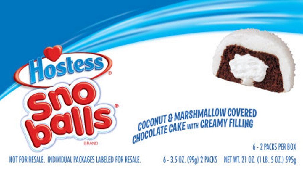 Hostess Snoballs creme-filled center with coconut flakes for indulgent bite.